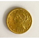 § A United States of America $5 coin,