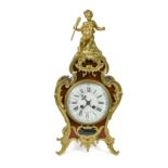 A Louis XV style simulated tortoiseshell and gilt metal mounted mantel clock,
