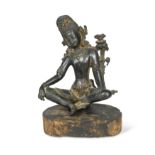 A Nepalese bronze Tara on wood stand