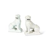 A pair of 18th century Delft white glazed models of lions,