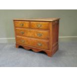 A walnut chest of two short and two long drawers, 79 x 107 x 48cm