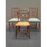 A pair of satinwood bedroom chairs, a Regency side chair and an oak open armchair