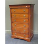 A reproduction cherrywood finish chest of six drawers, 141 x 93 x 56cm