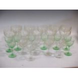 A set of ten Victorian goblets engraved with trailing vines, 14.5cm high; eight green tinged glasses