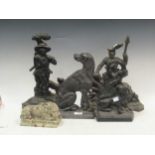 A collection of cast iron doorstops and a miniature Haddonstone recumbant lion