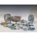 A collection of 18th century and later Chinese porcelain plates, bowls, cups and saucers