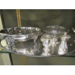 A collection of silverplated items including a large tray, candlesticks, coasters, tankard,