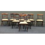 Two almost matching sets each of four dining room chairs with re upholstered seats (8)