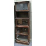 A Globe Wernicke oak sectional bookcase (one section associated and lacking glass), 212 x 71 x 36cm