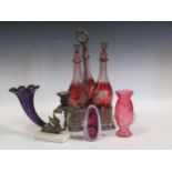 A three bottle decanter frame (one neck damaged), 2 Staffordshire figures, a purple glass horn