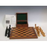 A boxwood and ebonised chess set, Staunton pattern, with a board, some pieces marked 'Staunton'