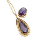 A colour-change synthetic corundum pendant, the mount tested as 9ct gold, on a 9ct gold chain,