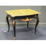 An Italianate style black and gold painted centre table,