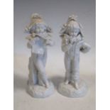 A pair of Continental blanc de chine spill vases modelled in the shape of boys 23cm high approx (2)