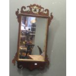 A mahogany tea caddy, a fretwork wall mirror, and a pair of balloon back dining chairs