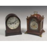 A reproduction walnut mantel clock with bell striking movement (Pendulum damage) and a mahogany dome