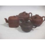 A Chinese Republic period red stoneware teapot; three other red stoneware teapots (4)