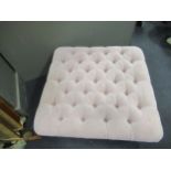 A pink velvet style buttoned upholstered foot stool 30 x 76 x 76cm