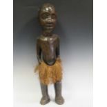 A large 75cm tall African Luba Hemba male figure with rush skirt and shell inlay