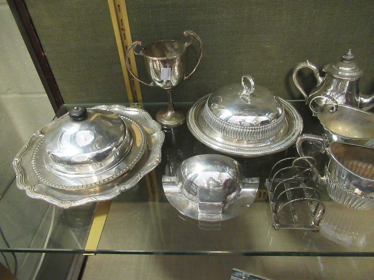 A large collection of silverplated ware including bowls, teapot, muffineers, flatware, condiments