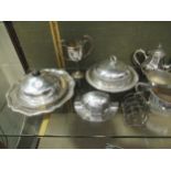 A large collection of silverplated ware including bowls, teapot, muffineers, flatware, condiments