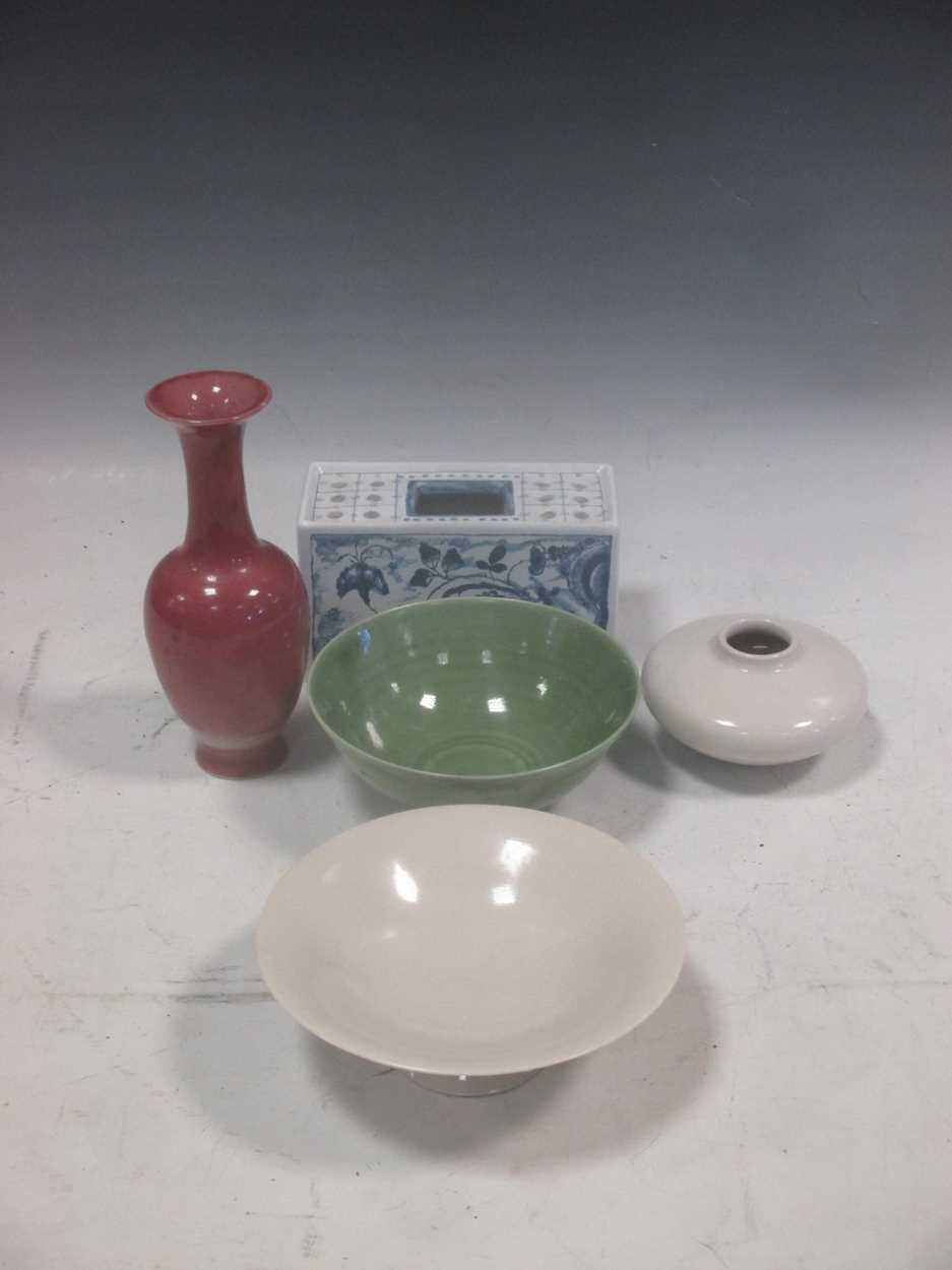 A modern Chinese celadaon bowl, a sang de boeuf vase, a modern Chinese white glazed bowl and a vase;