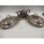 A collection of electroplated wares, including a pair of entrée dishes, a tea pot, tongs etc.