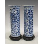 A pair of late 19th/20th century Chinese blue and white sleeve vases, 4 character mark, 25cm