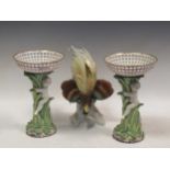 A pair of Berlin porcelain figural tazze together with a Karl Enns model of a bird of paradise