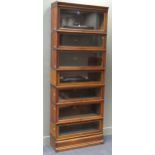 A Globe Wernicke oak seven section bookcase (with two associated sections), 232 x 87 x 29cm