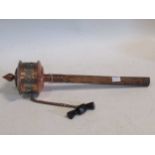 Tibethan prayer wheel, copper and mounted top with horn tassle, containing long paper scroll prayer