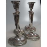 A set of four silver plated on copper candlesticks