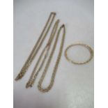 Three hallmarked 9ct gold chains together with a bangle stamped '375', gross weight 37.3g (4)