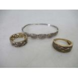 Two hallmarked 9ct gold rings, together with a hallmarked 9ct gold bangle, gross weight 15.4g (3)