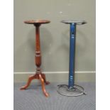 A reproduction torchere stand and a modern glass top stand with metal support. Mahogany tripod 85