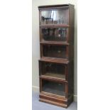 A Globe Wernicke oak sectional bookcase (with one associated section), 216 x 72 x 36cm