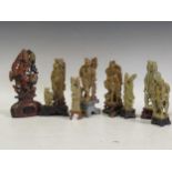 A collection of eight chinese soapstone figures and figure groups