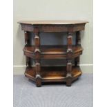 A 17th century style oak canted corner three tier side table on turned leg supports. 83.5 x 94 x