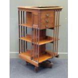 A mahogany square section revolving bookcase (top warped), with three tiers 119 x 60 x 60cm