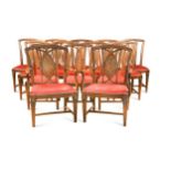 A set of fourteen walnut dining chairs including two armchairs, circa 1910,