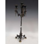 A French bronze three-branch Renaissance style candlestick, 53cm high