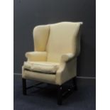 A George III style wingback armchair, yellow diaper upholstery, circa 82cm wide