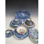 Various antique blue and white cups, bowls, plates and dishes