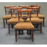 A set of six Regency mahogany dining chairs with bowed toprails on turned front legs and two