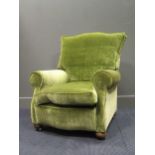 A green upholstered armchair