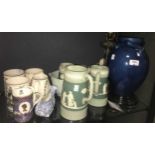 A Liberty blue glazed pottery vase, Wedgwood commemorative mugs, 4 graded Staffs jugs (cracked),