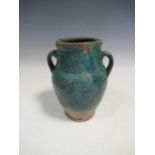 A Kashan pottery two-handled vase, 17cm high