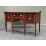 An Edwardian mahogany and crossbanded bow front sideboard with square tapering legs and spade