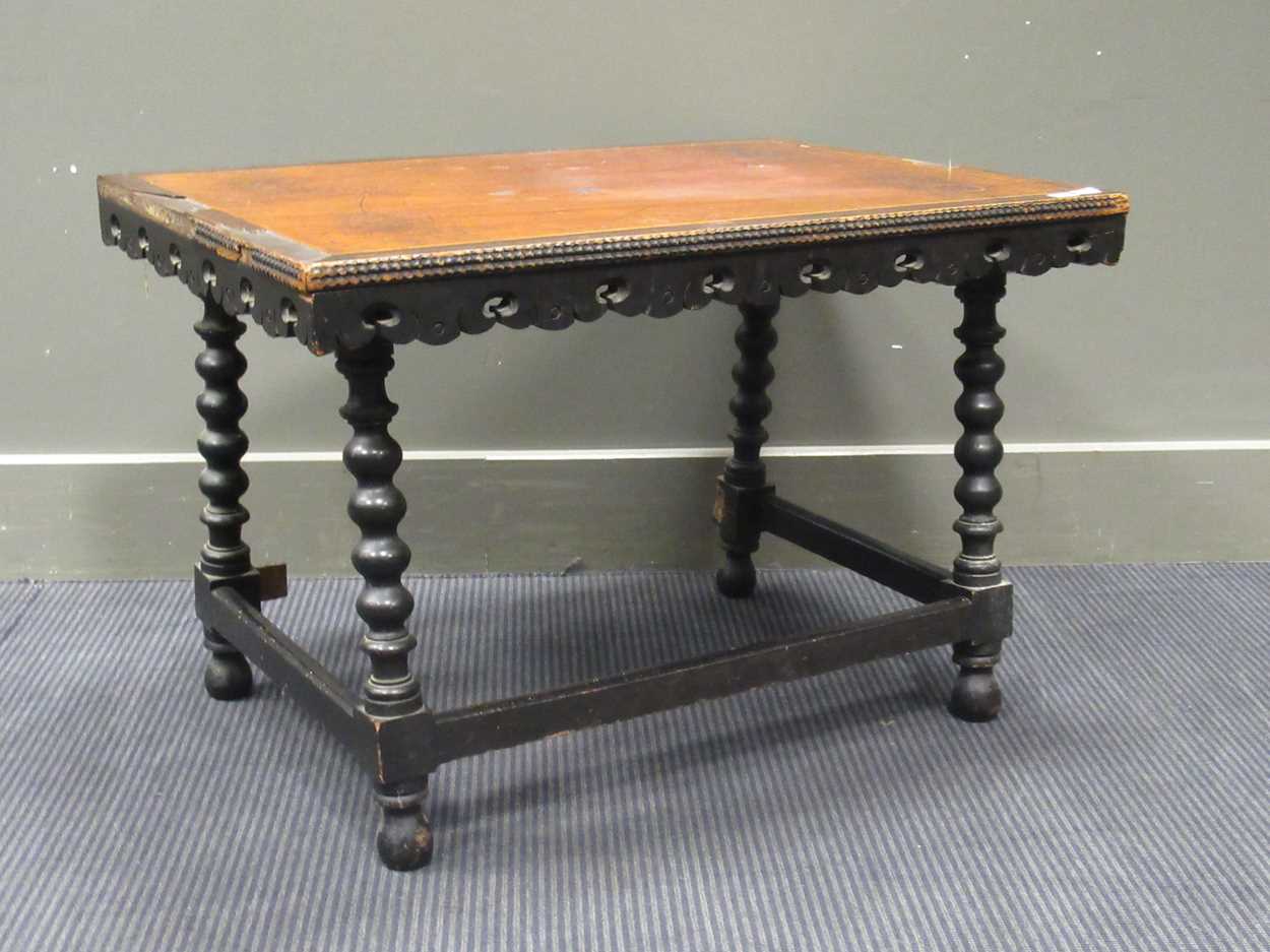 A Moorish style occasional table, the rectangular top above four bobbin turned supports 51 x 75 x