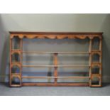 A set of modern oak plate shelves 122 high x 211 cm wide